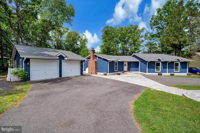 141 Eagle Ct, Locust Grove, VA 22508 - single story home with a garage, asphalt driveway, and a chimney