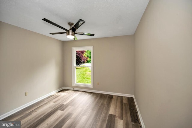 141 Eagle Ct, Locust Grove, VA 22508 - spare room with a ceiling fan, baseboards, wood finished floors, and a textured ceiling
