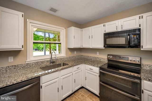 141 Eagle Ct, Locust Grove, VA 22508 - kitchen with black microwave, double oven range, a sink, dishwasher, and white cabinetry
