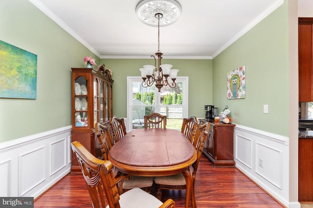 5930 Copper Mountain Dr W, Spotsylvania, VA 22553 - dining room featuring a chandelier, wood finished floors, ornamental molding, wainscoting, and a decorative wall