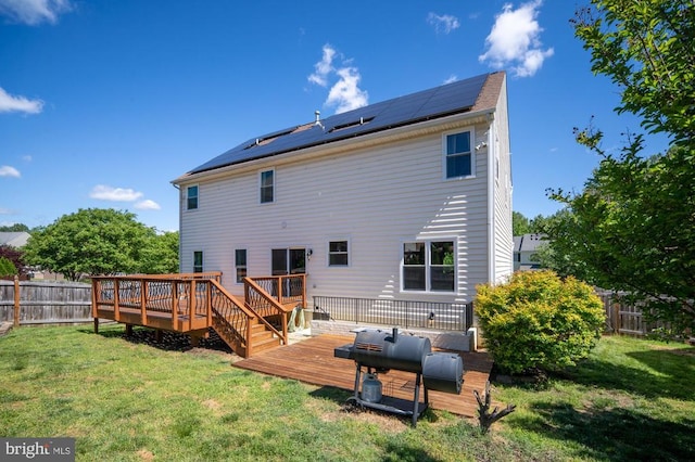 5930 Copper Mountain Dr W, Spotsylvania, VA 22553 - back of property with a deck and roof mounted solar panels