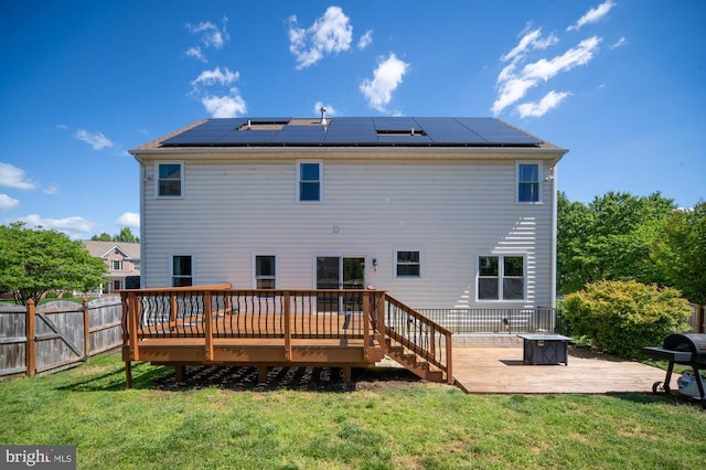5930 Copper Mountain Dr W, Spotsylvania, VA 22553 - rear view of property featuring a deck and roof mounted solar panels
