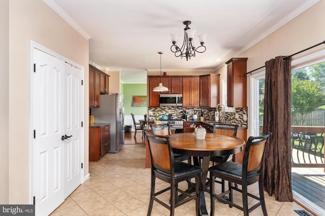 5930 Copper Mountain Dr W, Spotsylvania, VA 22553 - dining space with ornamental molding, light tile patterned flooring, and a chandelier