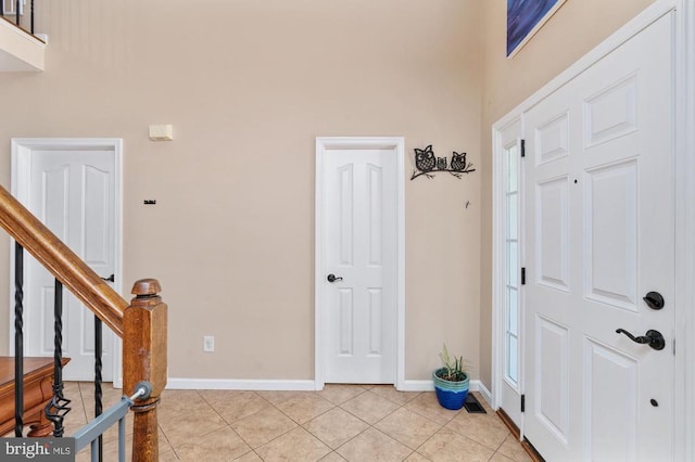 5930 Copper Mountain Dr W, Spotsylvania, VA 22553 - entrance foyer featuring light tile patterned floors, baseboards, and stairs