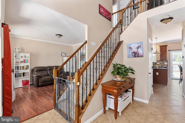 5930 Copper Mountain Dr W, Spotsylvania, VA 22553 - stairs featuring tile patterned flooring, crown molding, and baseboards