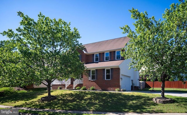 5930 Copper Mountain Dr W, Spotsylvania, VA 22553 - view of front facade with brick siding and a garage