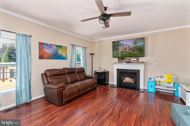 5930 Copper Mountain Dr W, Spotsylvania, VA 22553 - living area featuring ornamental molding, a ceiling fan, wood finished floors, a glass covered fireplace, and baseboards