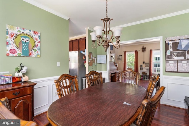 5930 Copper Mountain Dr W, Spotsylvania, VA 22553 - dining room with crown molding, a chandelier, a decorative wall, a wainscoted wall, and dark wood finished floors