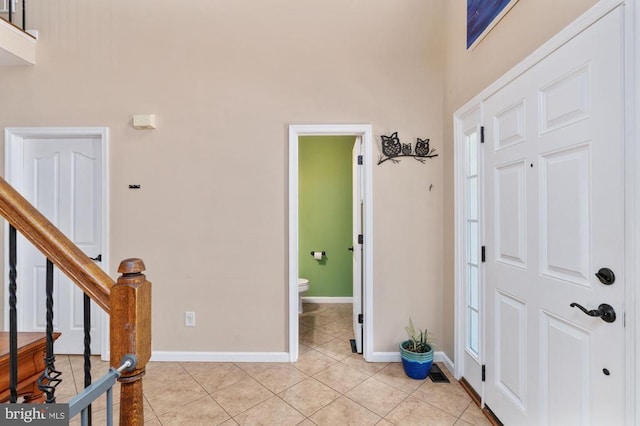 5930 Copper Mountain Dr W, Spotsylvania, VA 22553 - foyer entrance featuring light tile patterned floors, baseboards, and stairway