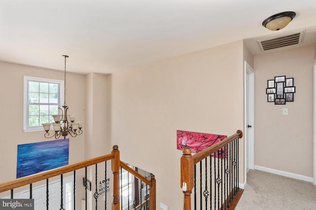 5930 Copper Mountain Dr W, Spotsylvania, VA 22553 - hallway with a chandelier, an upstairs landing, carpet flooring, and baseboards