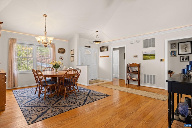 56 Wildwood Dr, Palmyra, VA 22963 - dining room with a chandelier, light wood-style flooring, ornamental molding, and lofted ceiling