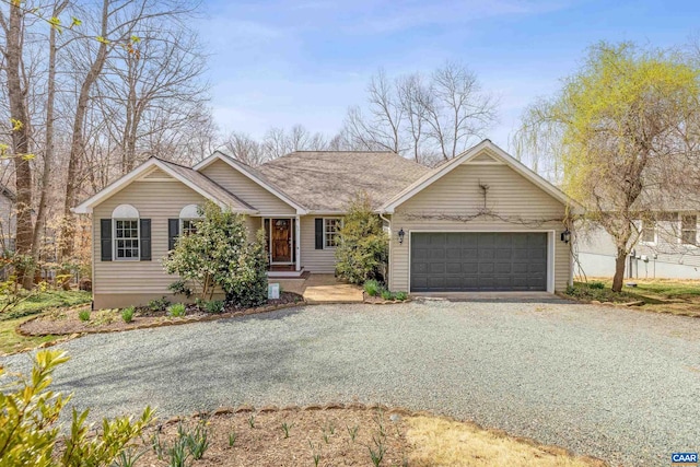 56 Wildwood Dr, Palmyra, VA 22963 - single story home with gravel driveway and a garage