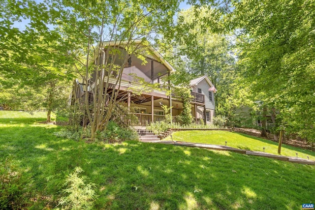 56 Wildwood Dr, Palmyra, VA 22963 - view of grassy yard with a wooden deck, a sunroom, and stairs