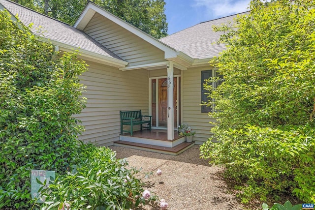 56 Wildwood Dr, Palmyra, VA 22963 - property entrance with roof with shingles and covered porch