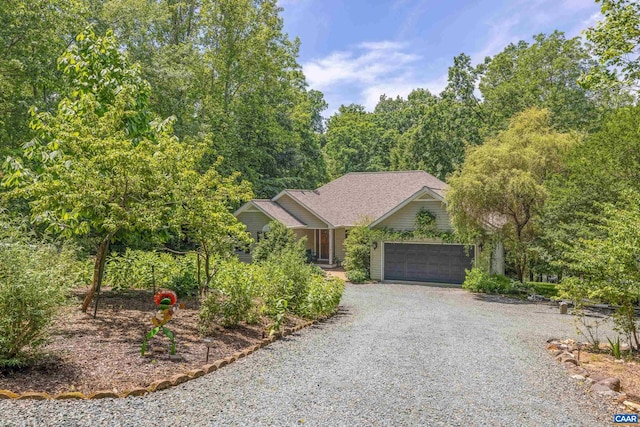 56 Wildwood Dr, Palmyra, VA 22963 - view of property hidden behind natural elements featuring gravel driveway and an attached garage