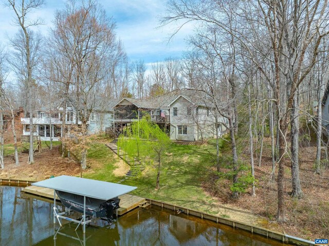 56 Wildwood Dr, Palmyra, VA 22963 - dock featuring boat lift, stairway, and a deck with water view