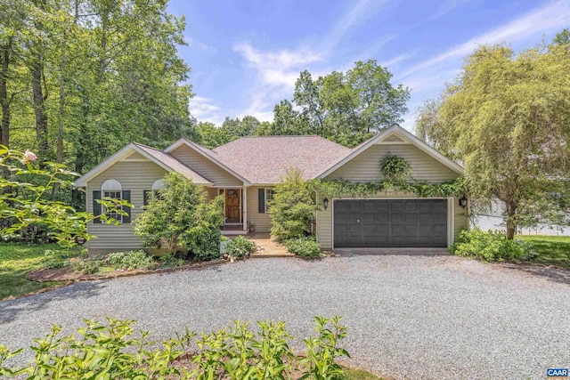 56 Wildwood Dr, Palmyra, VA 22963 - view of front of home featuring gravel driveway and an attached garage