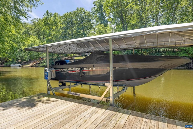 56 Wildwood Dr, Palmyra, VA 22963 - dock area with boat lift, a water view, and view of scattered trees
