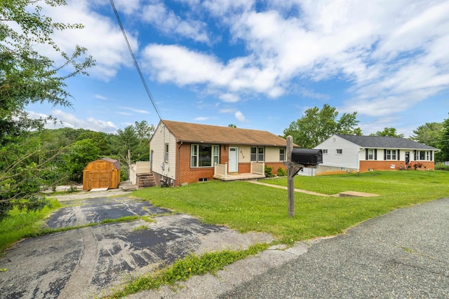 816 Rutherford St, Staunton, VA 24401 - bungalow-style home featuring a shed, brick siding, and a front yard