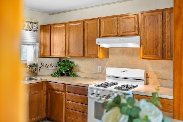 816 Rutherford St, Staunton, VA 24401 - kitchen featuring range hood, white range with gas stovetop, light countertops, and brown cabinetry
