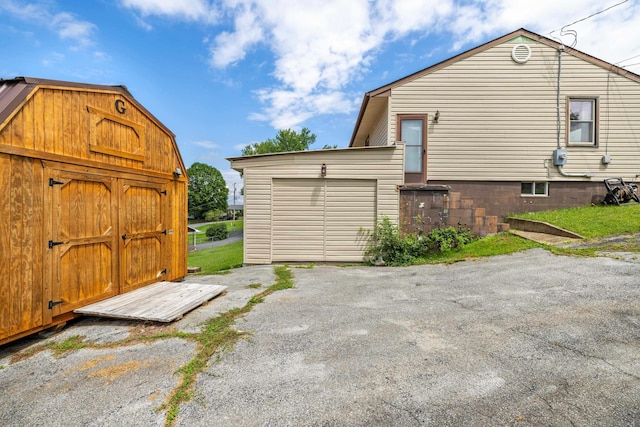 816 Rutherford St, Staunton, VA 24401 - view of property exterior with a storage shed and a garage