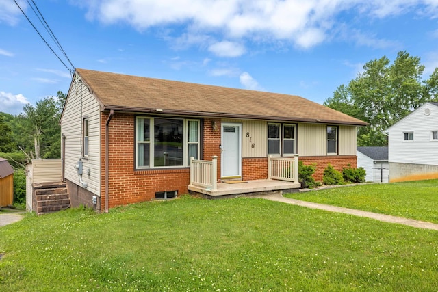 816 Rutherford St, Staunton, VA 24401 - view of front of home with brick siding, a front yard, and roof with shingles