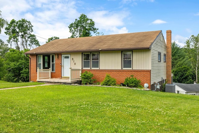 816 Rutherford St, Staunton, VA 24401 - view of front of home featuring brick siding, a front lawn, a shingled roof, and a chimney