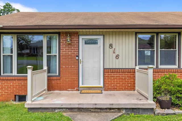 816 Rutherford St, Staunton, VA 24401 - view of exterior entry with brick siding and a shingled roof
