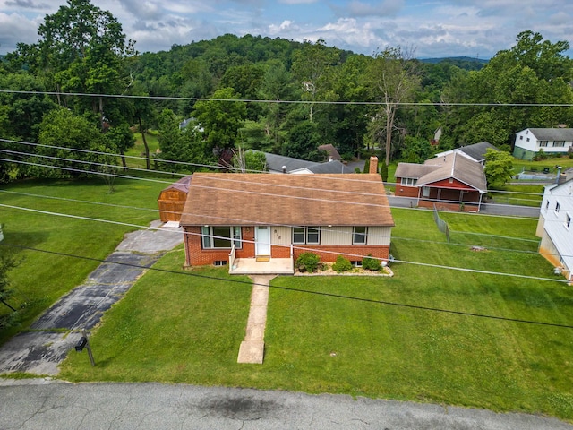 816 Rutherford St, Staunton, VA 24401 - view of front of property featuring a view of trees, a chimney, and brick siding