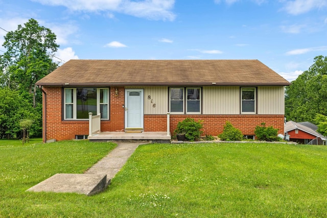 816 Rutherford St, Staunton, VA 24401 - view of front facade with a front yard, brick siding, and roof with shingles
