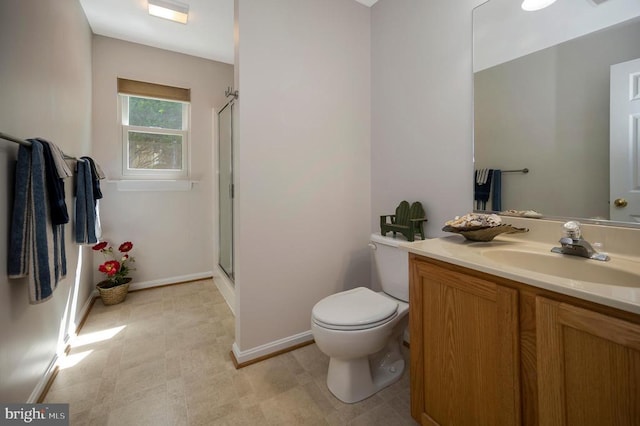 317 Edgehill Dr, Locust Grove, VA 22508 - bathroom featuring a shower with shower door, baseboards, toilet, and vanity