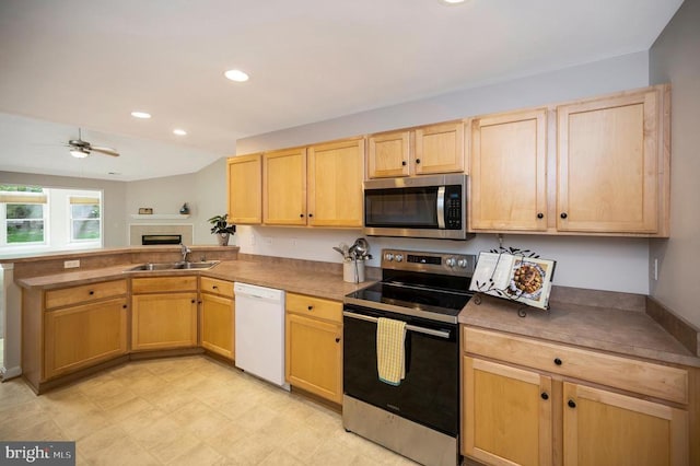 317 Edgehill Dr, Locust Grove, VA 22508 - kitchen featuring appliances with stainless steel finishes, a sink, a peninsula, light brown cabinets, and a ceiling fan