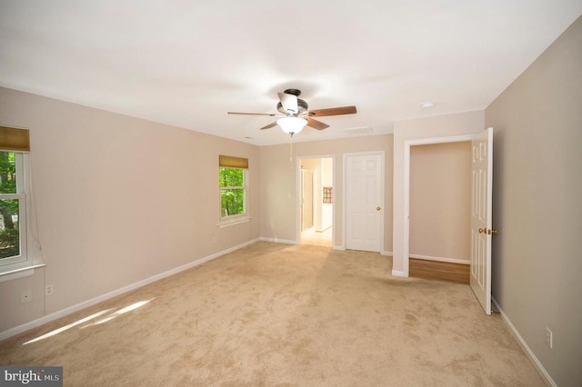 317 Edgehill Dr, Locust Grove, VA 22508 - unfurnished bedroom featuring light carpet, baseboards, and ceiling fan