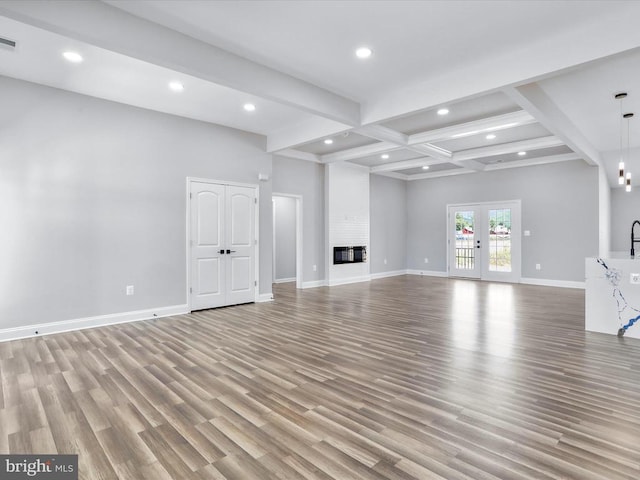 91 Arthur Ln, Luray, VA 22835 - unfurnished living room with recessed lighting, light wood-style flooring, baseboards, beamed ceiling, and coffered ceiling