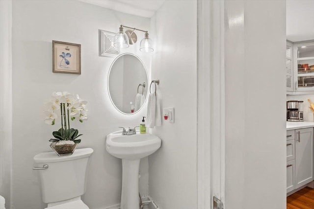 half bath featuring toilet