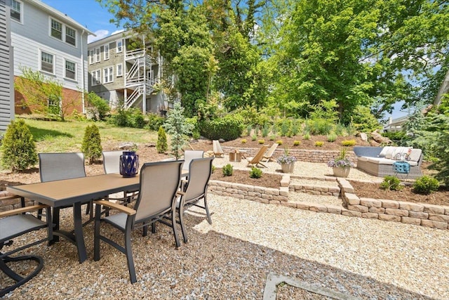 view of patio / terrace with outdoor dining area and an outdoor hangout area