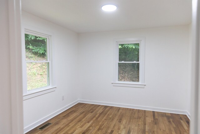 164 28th St E, Buena Vista, VA 24416 - unfurnished room featuring plenty of natural light and wood finished floors