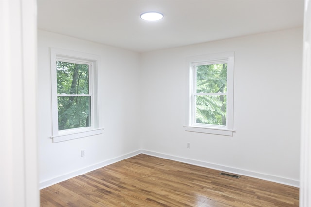 164 28th St E, Buena Vista, VA 24416 - empty room featuring healthy amount of natural light and wood finished floors