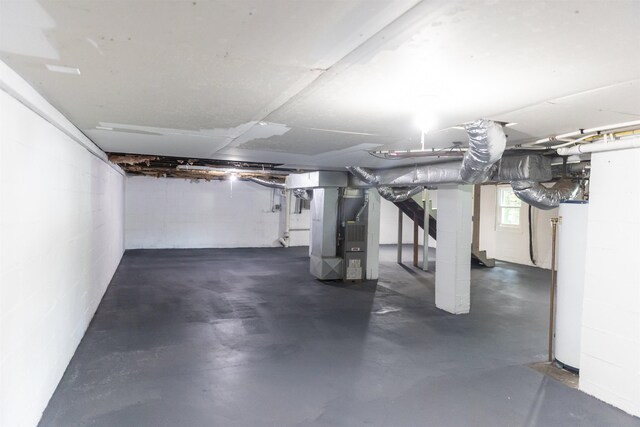 164 28th St E, Buena Vista, VA 24416 - basement with water heater, heating unit, stairs, and concrete block wall