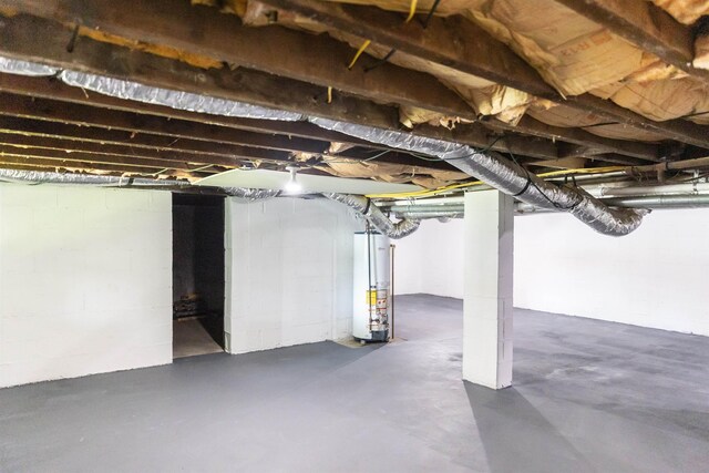 164 28th St E, Buena Vista, VA 24416 - unfinished basement featuring gas water heater and concrete block wall