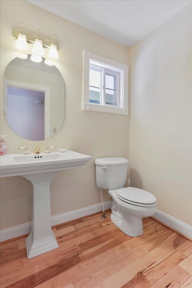 114 Meagans Run Rd, Woodstock, VA 22664 - bathroom with wood finished floors and toilet