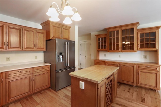 114 Meagans Run Rd, Woodstock, VA 22664 - kitchen with high quality fridge, light wood-style flooring, a chandelier, and brown cabinets
