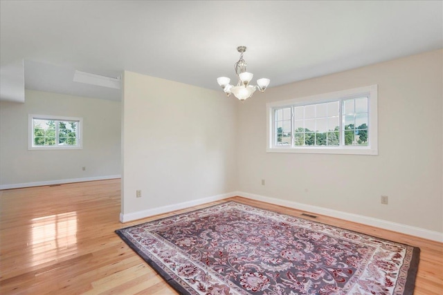 114 Meagans Run Rd, Woodstock, VA 22664 - unfurnished room featuring a chandelier and wood finished floors