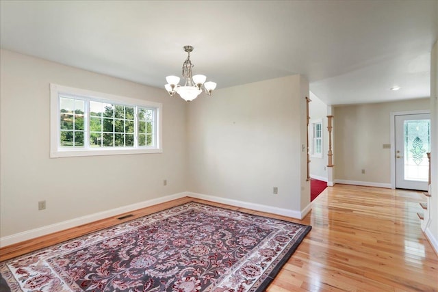 114 Meagans Run Rd, Woodstock, VA 22664 - unfurnished room with light wood finished floors and a chandelier