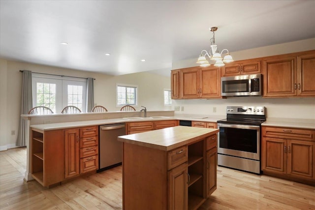114 Meagans Run Rd, Woodstock, VA 22664 - kitchen with stainless steel appliances, open shelves, a peninsula, a chandelier, and light wood-type flooring