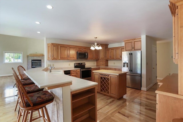 114 Meagans Run Rd, Woodstock, VA 22664 - kitchen with appliances with stainless steel finishes, light countertops, a chandelier, light wood-type flooring, and recessed lighting