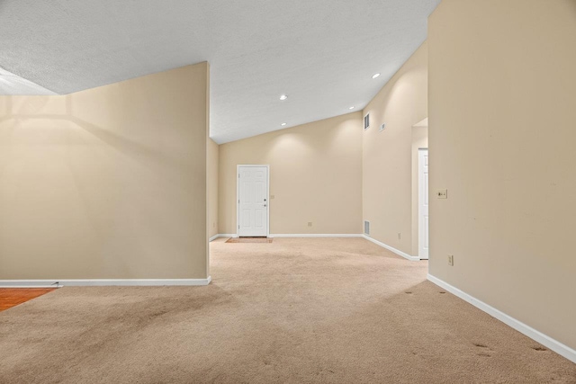 127 Emerald Dr, Harrisonburg, VA 22801 - spare room featuring lofted ceiling, light colored carpet, baseboards, and recessed lighting