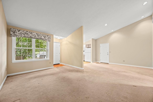 127 Emerald Dr, Harrisonburg, VA 22801 - unfurnished living room featuring light colored carpet, baseboards, lofted ceiling, and recessed lighting
