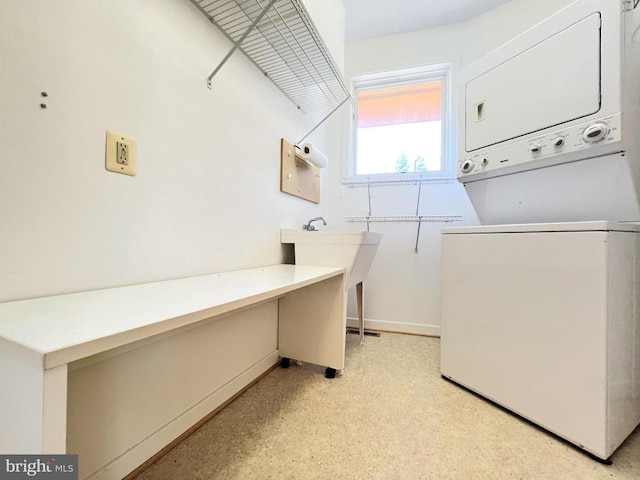 243 Aaron Mountain Rd, Castleton, VA 22716 - clothes washing area with stacked washer and clothes dryer and baseboards