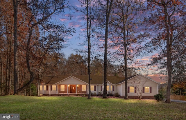 ranch-style house featuring a lawn